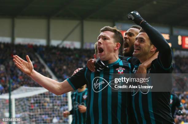 Pierre-Emile Hojbjerg of Southampton celebrates as he scores their first goal with Dusan Tadic and Ryan Bertrand during The Emirates FA Cup Quarter...