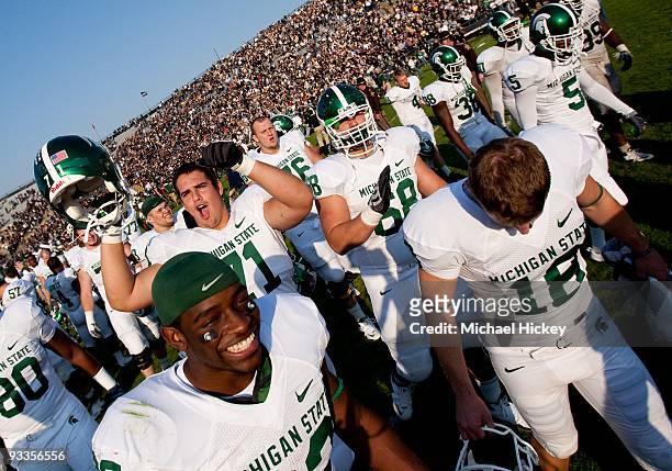 Members of the Michigan State Spartans celebrate their win over the Purdue Boilermakers at Ross-Ade Stadium on November 14, 2009 in West Lafayette,...