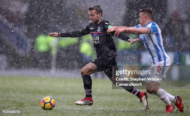 Crystal Palace's Yohan Cabaye and Huddersfield Town's Jonathan Hogg during the Premier League match between Huddersfield Town and Crystal Palace at...