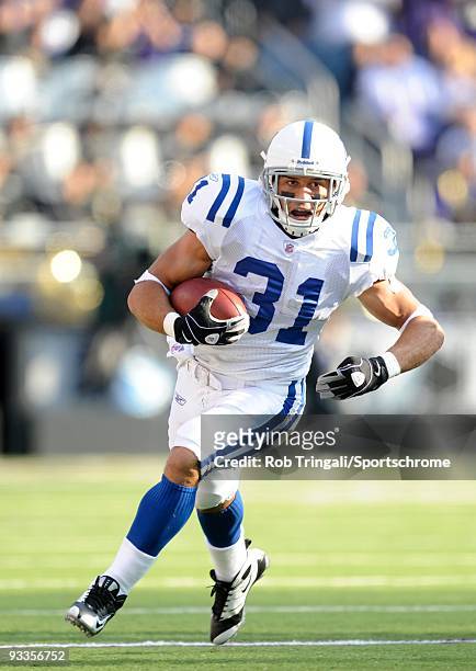 Donald Brown of the Indianapolis Colts rushes against the Baltimore Ravens at M&T Bank Stadium on November 22, 2009 in Baltimore, Maryland. The Colts...