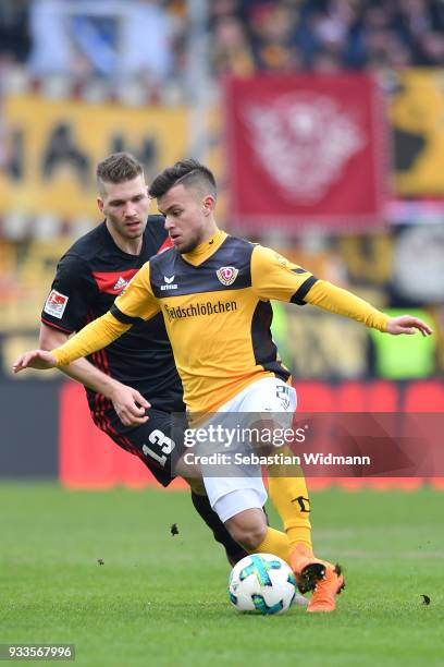Sascha Horvath of Dresden and Robert Leipertz of Ingolstadt compete for the ball during the Second Bundesliga match between FC Ingolstadt 04 and SG...