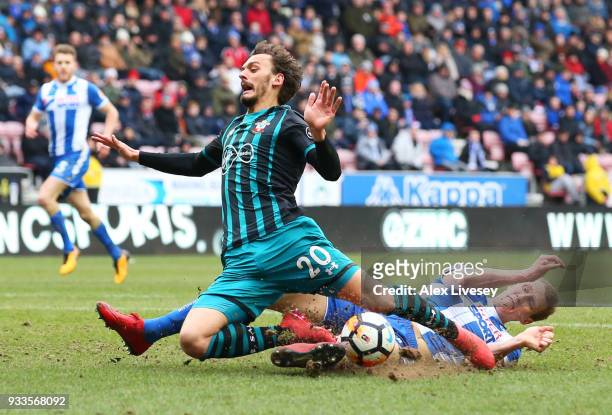 Manolo Gabbiadini of Southampton is fouled by Dan Burn of Wigan Athletic for a penalty during The Emirates FA Cup Quarter Final match between Wigan...