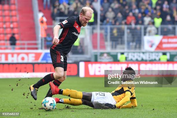 Moussa Kone of Dresden challenges Tobias Levels of Ingolstadt for the ball during the Second Bundesliga match between FC Ingolstadt 04 and SG Dynamo...