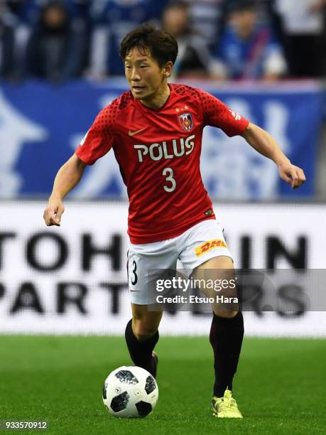 Tomoya Ugajin of Urawa Red Diamonds in action during the J.League J1 match between Urawa Red Diamonds and Yokohama F.Marinos at Saitama Stadium on...