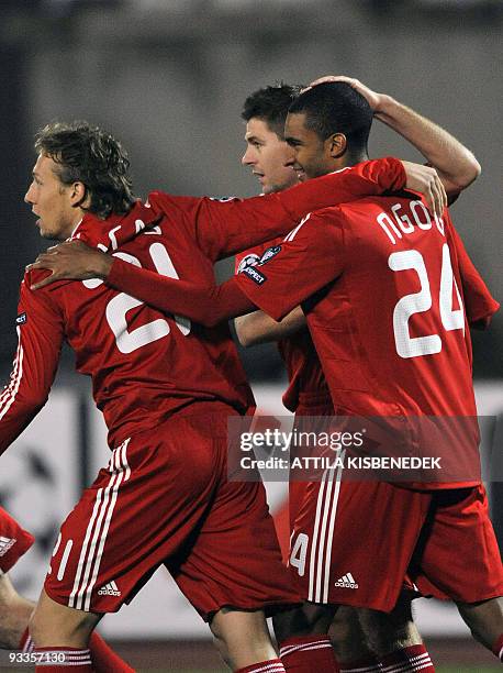 Liverpool's David Ngog celebrates his score with Lucas and Steven Gerrard during their UEFA Champions League football match against Hungarian VSC...