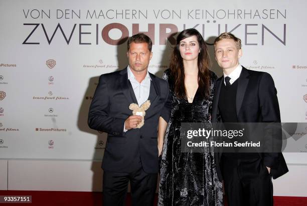 Actor Til Schweiger, actress Nora Tschirner and actor Matthias Schweighoefer attend the premiere of 'Zweiohrkueken' at the Sony Center CineStar on...