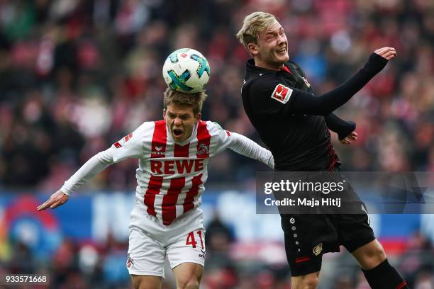 Vincent Koziello of 1.FC Koeln and Julian Brandt of Bayer Leverkusen during the Bundesliga match between 1. FC Koeln and Bayer 04 Leverkusen at...