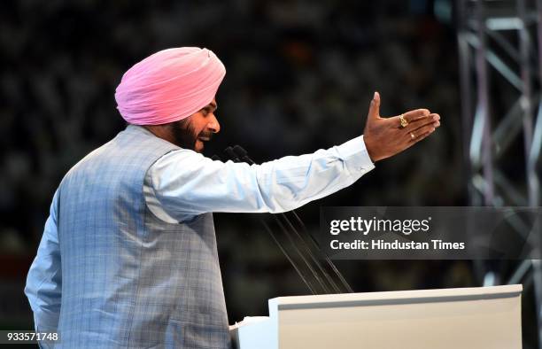 Punjab minister Navjot Singh Sidhu speaks during the second day of the 84th Plenary Session of Indian National Congress at the Indira Gandhi stadium,...