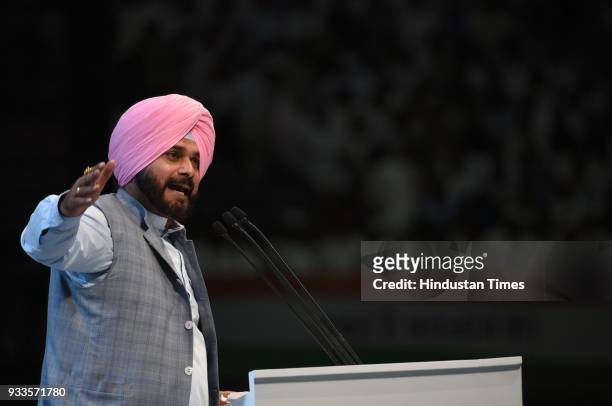 Punjab minister Navjot Singh Sidhu speaks during the second day of the 84th Plenary Session of Indian National Congress at the Indira Gandhi stadium,...