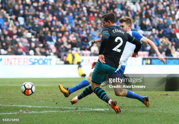Cedric Soares of Southampton scores their second goal during The Emirates FA Cup Quarter Final match between Wigan Athletic and Southampton at DW...