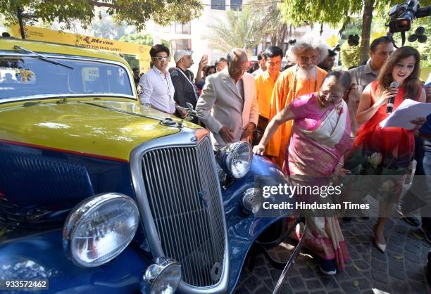 Lok Sabha speaker Sumitra Mahajan having a close look at the cars during the JK Tyre Constitution Club Car Rally 2018, to raise awareness on safe...