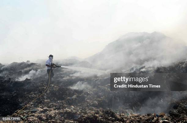 Ambernath dumping ground caught major fire on Saturday releasing thick smoke in the nearby areas, on March 17, 2018 in Mumbai, India. Two fire...