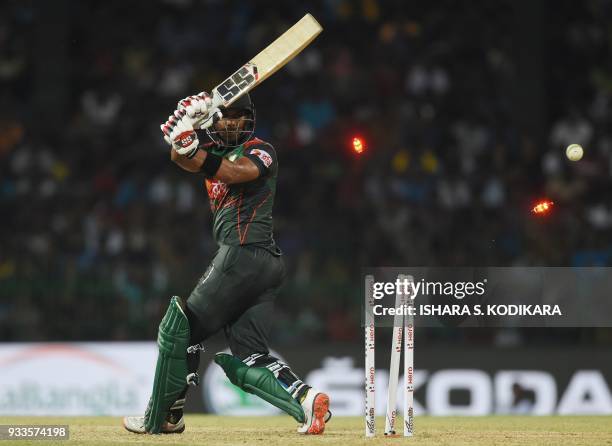 Bangladeshi cricketer Sabbir Rahman is bowled by Indian bowler Jaydev Unadkat during the final Twenty20 international cricket match between...