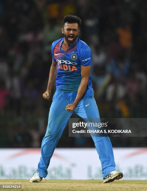 Indian cricketer Jaydev Unadkat celebrates after he dismissed Bangladeshi cricketer Sabbir Rahman during the final Twenty20 international cricket...