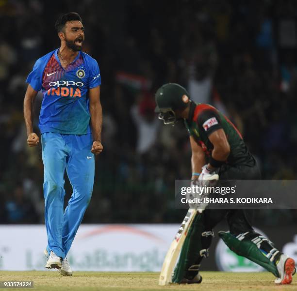 Indian cricketer Jaydev Unadkat celebrates after he dismissed Bangladeshi cricketer Sabbir Rahman during the final Twenty20 international cricket...