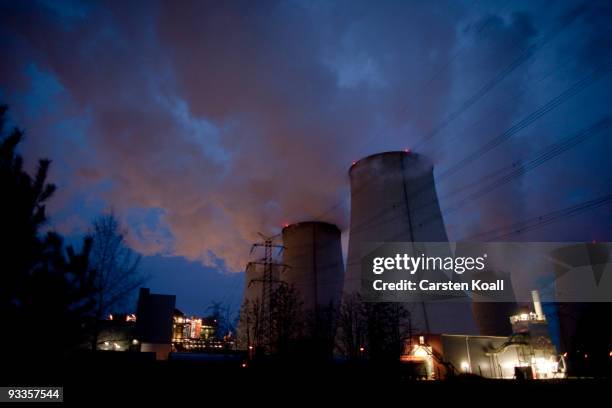 Exhaust plumes from cooling towers at the Jaenschwalde lignite coal-fired power station, which is owned by Vatenfall, on November 24, 2009 in...