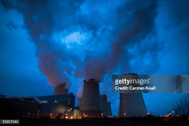 Exhaust plumes from cooling towers at the Jaenschwalde lignite coal-fired power station, which is owned by Vatenfall, on November 24, 2009 in...