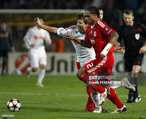 Glen Johnson of Liverpool and Decebren's defender Zsolt Laczko of Hungarian VSC Debrecen battle for the ball during the UEFA Champions League match...