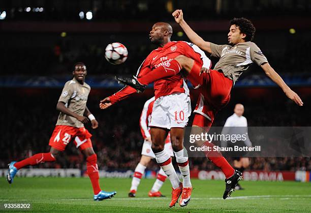 William Gallas of Arsenal is challenged by Felipe of Standard Liege during the UEFA Champions League group H match between Arsenal and Standard Liege...