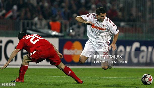 Argentin Javier Mascerano of Liverpool and Debrecen's defender Zoltan Szelesi of Hungarian VSC Debrecen battle for the ball during the UEFA Champions...