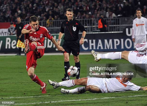 Liverpool's Javier Mascherano fights for the ball with Hungarian Laszlo Bodnar of VSC Debrecen in the Puskas stadium of Budapest on November 24, 2009...