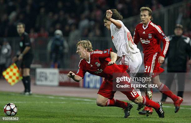 Dutch Dirk Kuyt of Liverpool and Decebren's defender Zsolt Laczko of Hungarian VSC Debrecen battle for the ball during the UEFA Champions League...