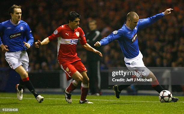 Kenny Miller of Rangers tackles Ricardo Osorio of VfB Stuttgart during the UEFA Champions League Group G match between Rangers and VfB Stuttgart at...