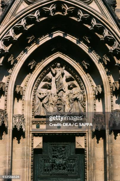 Lateral entrance to St Vitus cathedral, relief with the ascension of Christ, historic centre of Prague , Czech Republic, 14th-20th century.