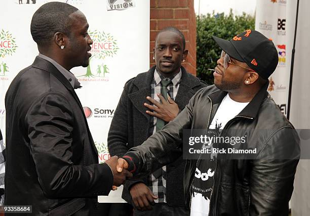 Recording Artist, Akon, VP DefJam Bu Thiam and Outkast's Big Boi at South Cobb High School to give turkeys to families in need on November 24, 2009...