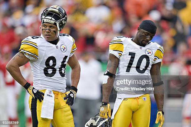 Wide receivers Hines Ward and Mike Wallace of the Pittsburgh Steelers stand on the field together during NFL action against the Kansas City Chiefs at...