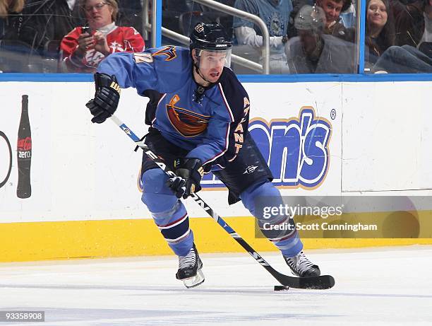 Todd White of the Atlanta Thrashers fires a pass against the Pittsburgh Penguins at Philips Arena on November 21, 2009 in Atlanta, Georgia.