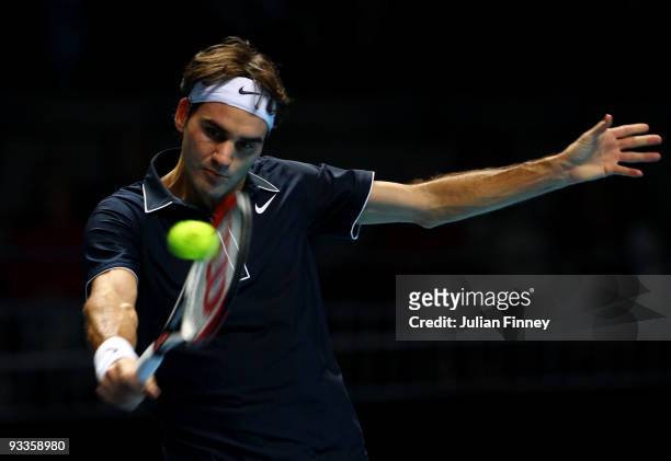 Roger Federer of Switzerland returns the ball during the men's singles second round match against Andy Murray of Great Britain during the Barclays...