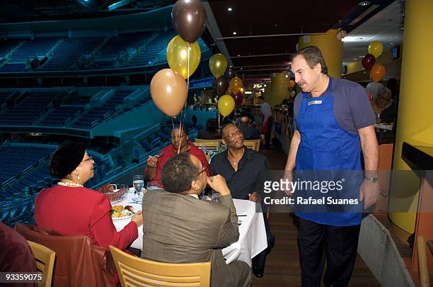 Ernie Grunfeld, President of the Washington Wizards, stops and chats with senior DC residents as part of the Thanksgiving Lunch at Verizon Center on...