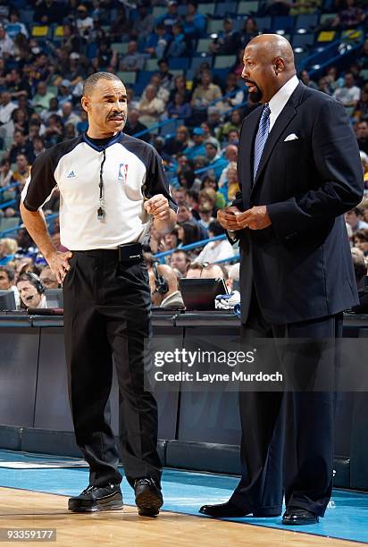 Referee Dan Crawford and head coach Mike Woodson of the Atlanta Hawks talk during the game between the Atlanta Hawks and the New Orleans Hornets on...
