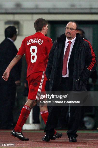 Steven Gerrard of Liverpool walks past Manager Rafael Benitez as he is substituted during the UEFA Champions League group E match between Debrecen...