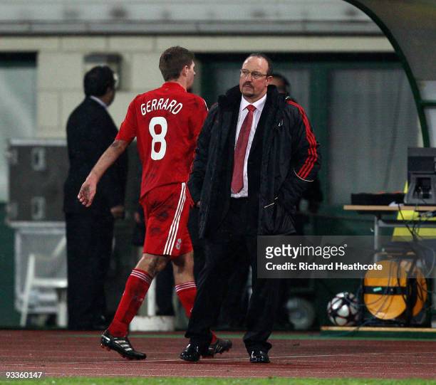 Steven Gerrard of Liverpool walks past Manager Rafael Benitez as he is substituted during the UEFA Champions League group E match between Debrecen...