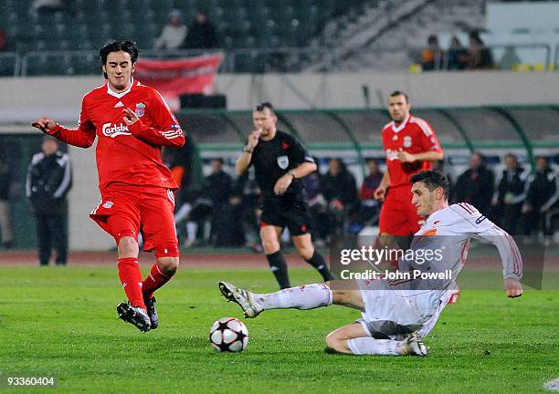 Alberto Aquilani of Liverpool competes for the ball with Gergely Rudolf of Debrecen during the UEFA Champions League group E match between Debrecen...