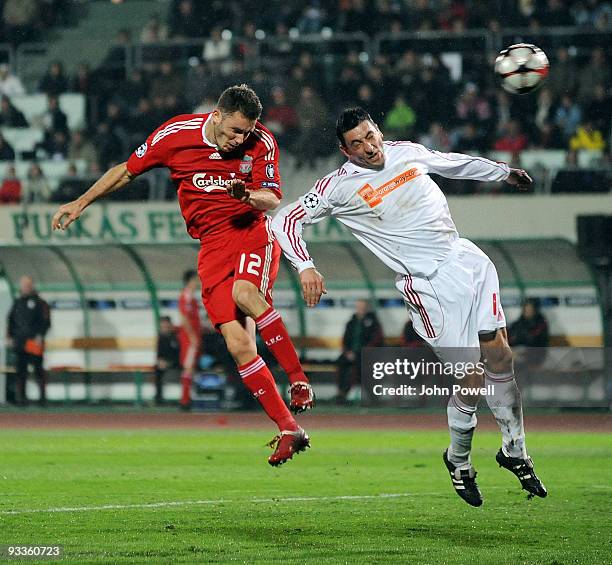 Fabio Aurelio of Liverpool heads it just wide of the goal during the UEFA Champions League group E match between Debrecen and Liverpool at the Ferenc...