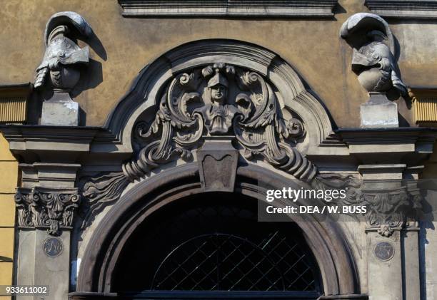 Bas relief with helmets on a door, architectural detail, Krakow Historic Centre , Poland.