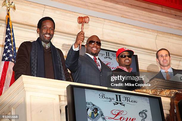 Boyz II Men singers Shawn Stockman, Wanya Morris, and Nathan Morris ring the closing bell at the New York Stock Exchange on November 24, 2009 in New...