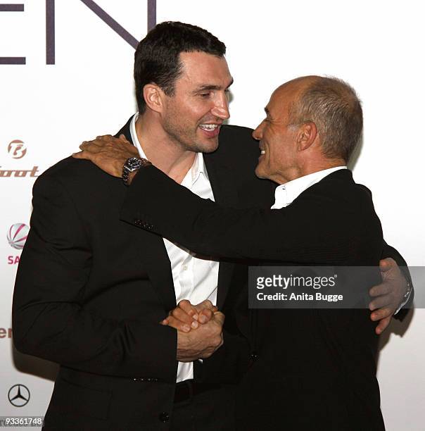 Vladimir Klitschko and actor Heiner Lauterbach attend the premiere of 'Zweiohrkueken' at the Sony Center CineStar on November 24, 2009 in Berlin,...