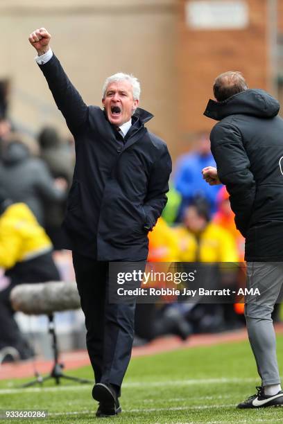 WIGAN, ENGLAND Mark Hughes head coach / manager of Southampton celebrates the second goal during The Emirates FA Cup Quarter Final match at DW...