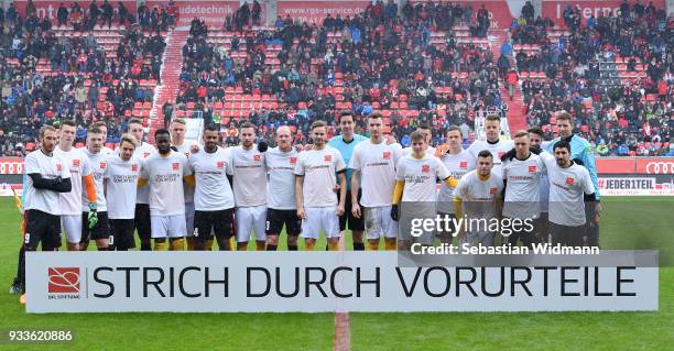 Players of Ingolstadt and of Dresden pose with a sign for the campaign Strich durch Vorurteile prior to the Second Bundesliga match between FC...