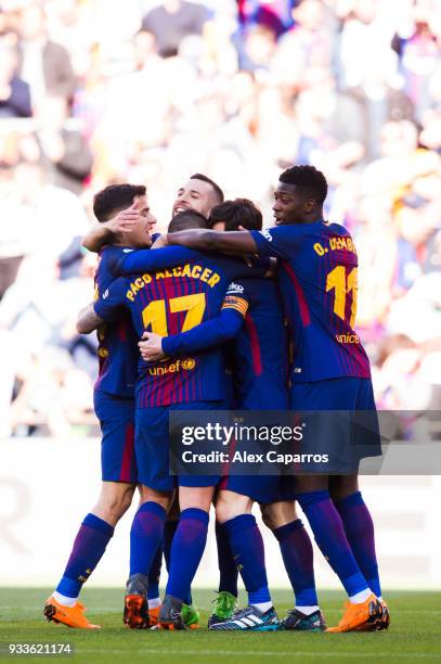 Players of FC Barcelona celebrate after their teammate Paco Alcacer scored the opening goal during the La Liga match between Barcelona and Athletic...