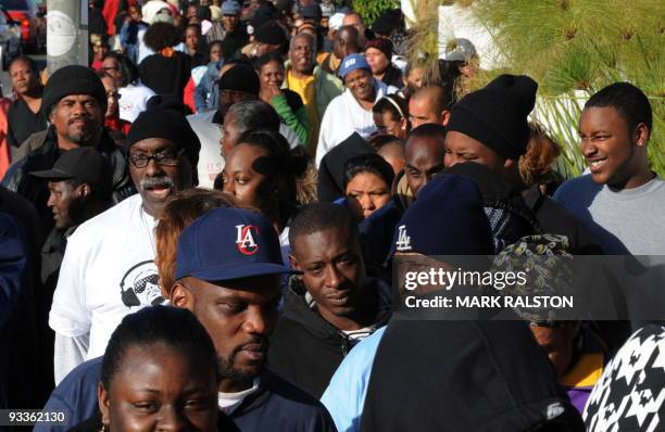 Group of 10,000 low-income and needy people who lined up to receive free Thanksgiving turkeys and fixings distributed by the Jackson Limousine...