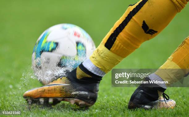 Water drops fly off a shoe while the player is hitting a ball during the Second Bundesliga match between FC Ingolstadt 04 and SG Dynamo Dresden at...