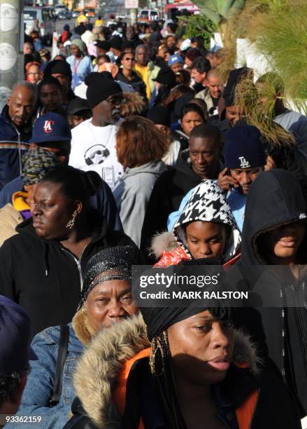 Group of 10,000 low-income and needy people who lined up to receive free Thanksgiving turkeys and fixings distributed by the Jackson Limousine...