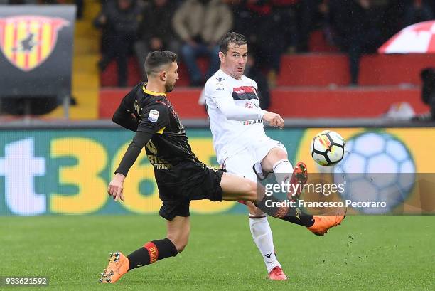 Danilo Cataldi of Benevento Calcio vies with Simone Padoin of Cagliari Calcio during the serie A match between Benevento Calcio and Cagliari Calcio...