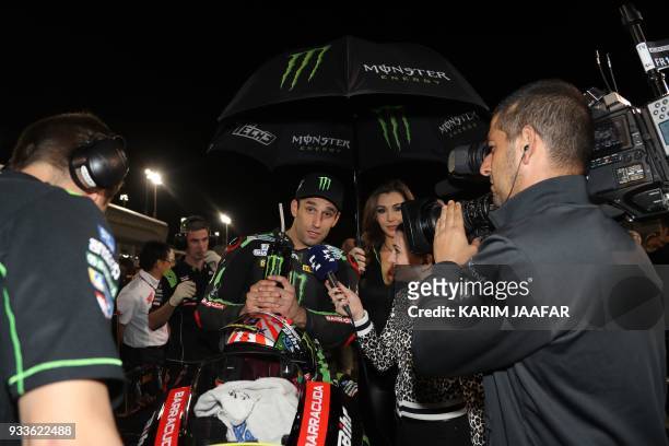 Monster Yamaha Tech 3's French rider Johann Zarco answers the press prior to the 2018 Qatar Moto GP Grand Prix at the Losail International Circuit in...