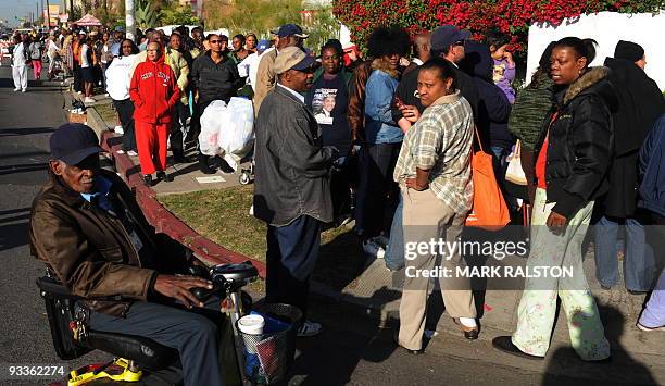 Group of 10,000 low-income and needy people who lined up to receive free Thanksgiving turkeys and fixings distributed by the Jackson Limousine...